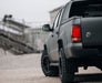 Gray pickup truck with a marine car emblem